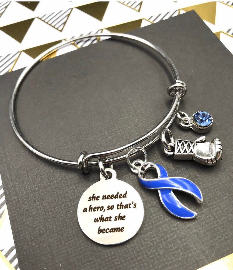 Periwinkle Ribbon Charm Bracelet – She Needed a Hero ... So That's What She Became - Rock Your Cause Jewelry