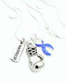 Periwinkle ribbon boxing glove and warrior necklace from Rock Your Cause Jewelry, featuring bold design and symbolic accessories.