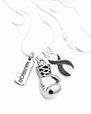 Black Ribbon Boxing Glove Necklace by Rock Your Cause Jewelry, featuring a detailed black boxing glove pendant on a necklace chain.