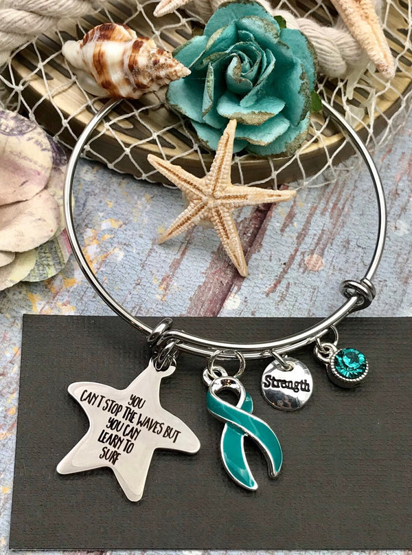 Teal Ribbon Charm Bracelet You Can't Stop The Waves, But You Can Learn To Surf - Rock Your Cause Jewelry