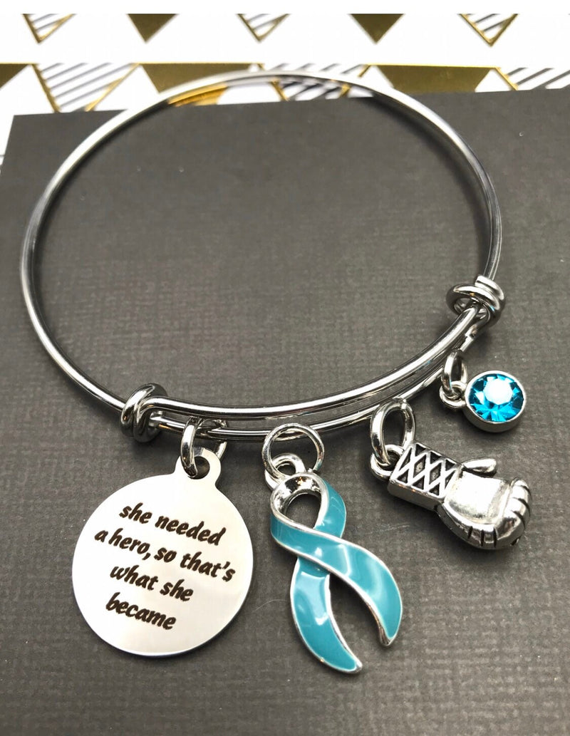Light Blue Ribbon Bracelet - She Needed a Hero, So That's What She Became - Rock Your Cause Jewelry