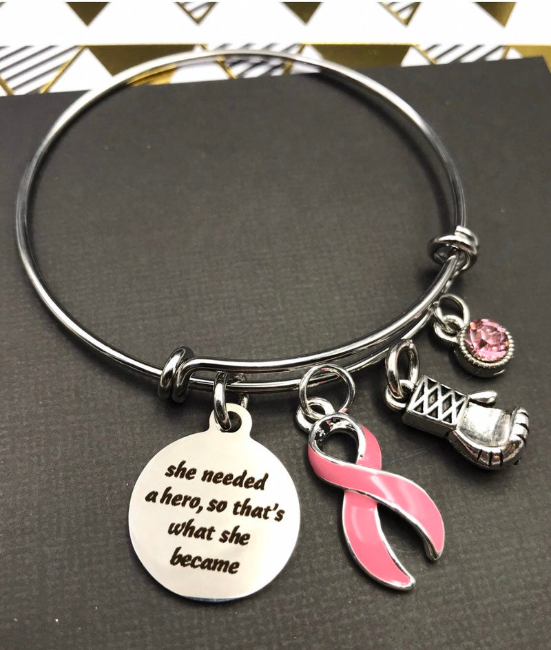 Pink Ribbon Charm Bracelet - She Needed a Hero, So That's What She Became - Rock Your Cause Jewelry